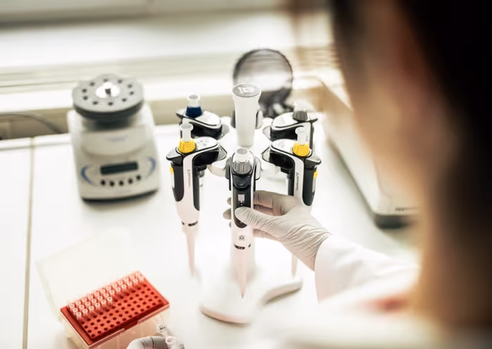 Laboratory staff pipetting
